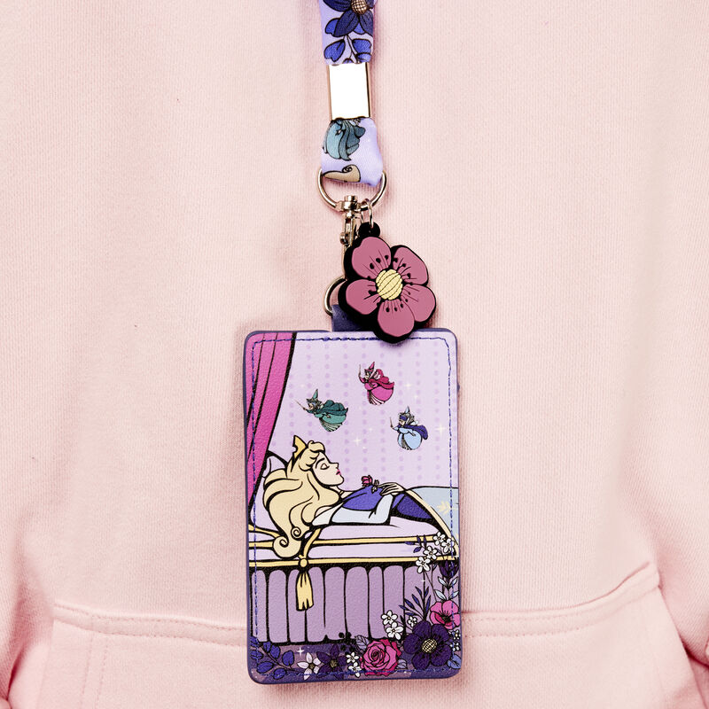 Image of someone wearing the Loungefly Disney Sleeping Beauty 65th Anniversary Floral Scene Lanyard with Card Holder